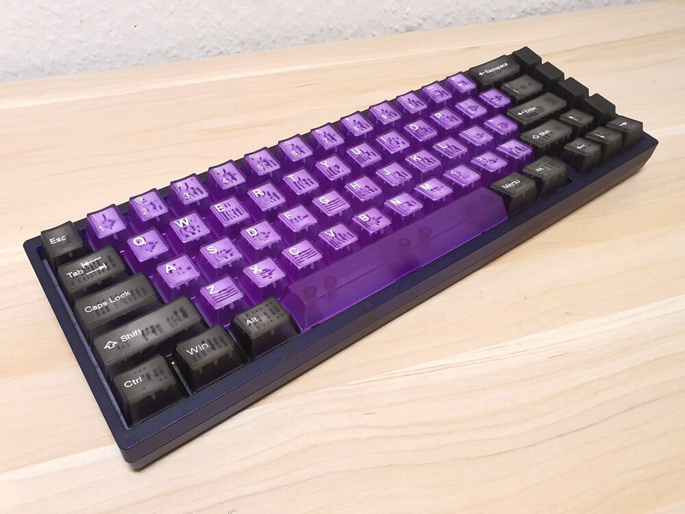 The finished build with a mix of Tai-Hao Atomic Purple and Smokey Quartz keycaps