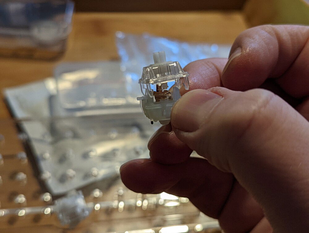 Much taller to be under greater tension and all but eliminated ping without any lube.