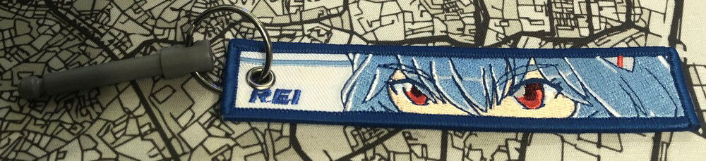 Embroidered fabric hang tag for standing desk safety pin (side a)